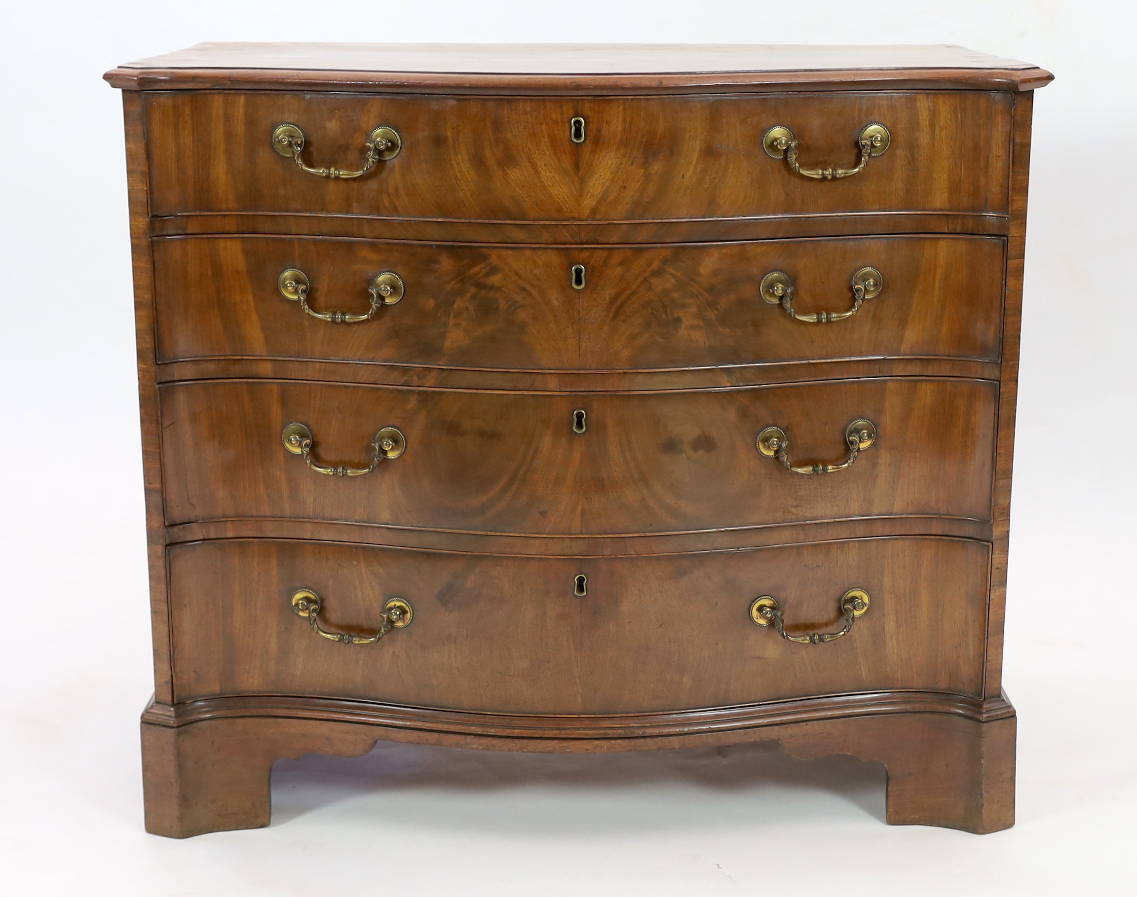 A George III mahogany serpentine dressing chest